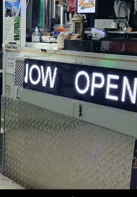 Najcos scrolling LED sign installed at Khaapa Shaapa food stall in Coolaroo, running NOW OPEN